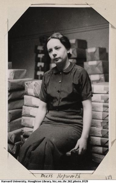  Virginia Woolf Monk's House photograph album, MH-5 Barbara Hepworth sitting among Hogarth Press books, undated.