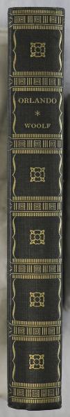 Spine of First American Edition of Orlando by Virginia Woolf. Dull blue cloth with gold lettering and ornaments.